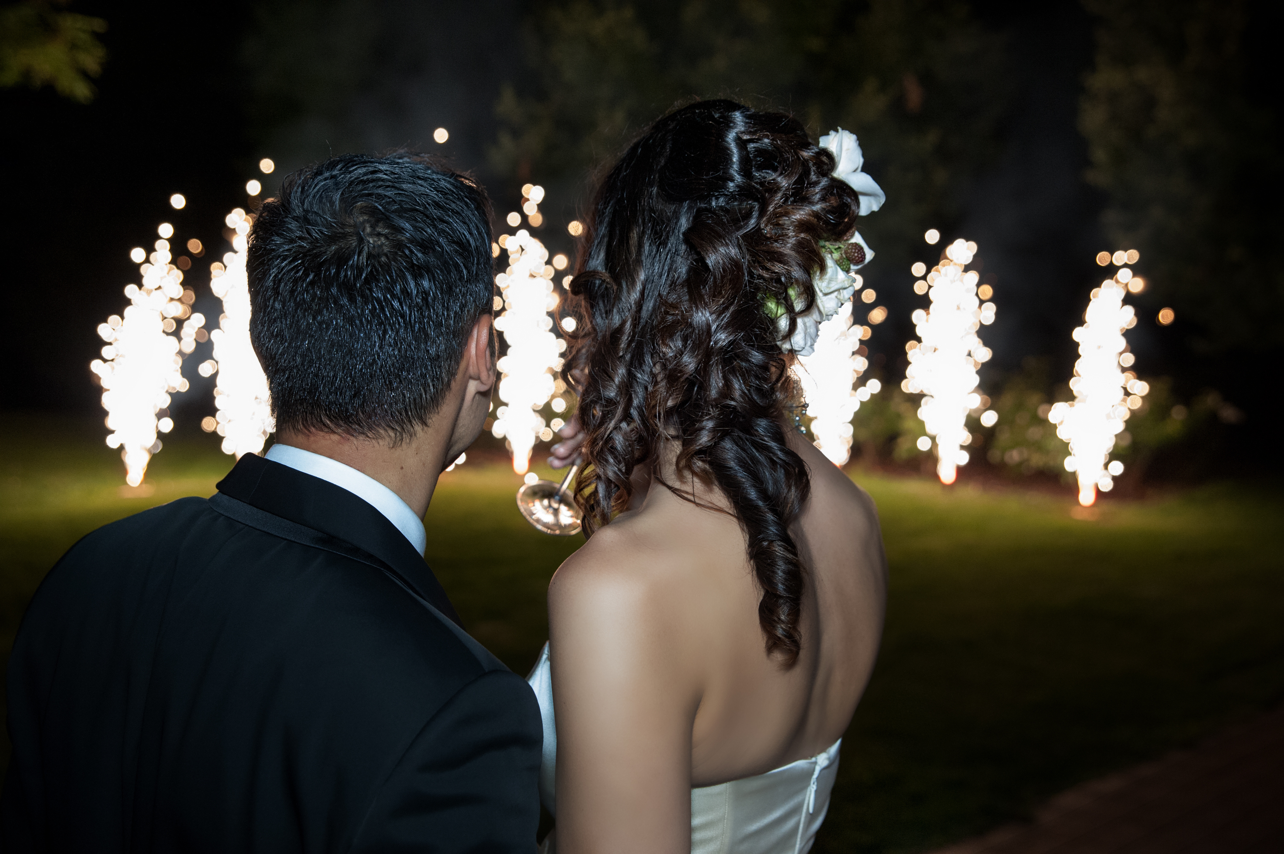 Newlyweds watch a close proximate fireworks show by a NJ wedding fireworks company