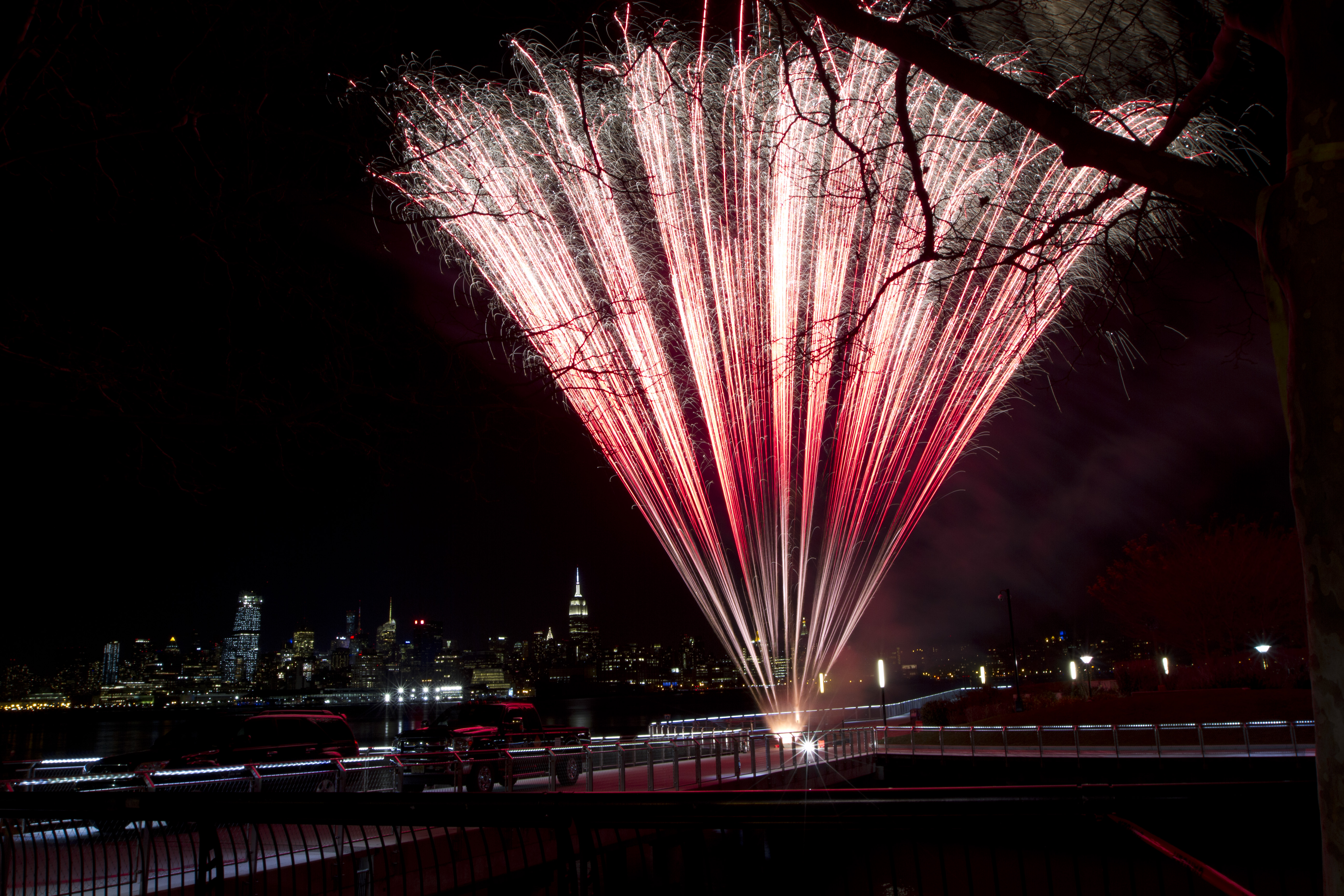 A bright red fan cake is ignited near New York City during a NJ wedding fireworks show.
