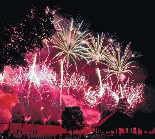 A beautiful display of fireworks over water during a PA fireworks show by a NJ fireworks company.